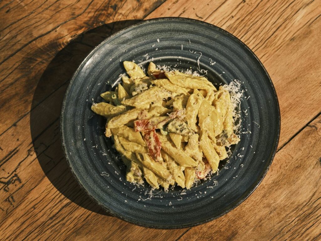 Penne in a cream sauce finished with grated cheese